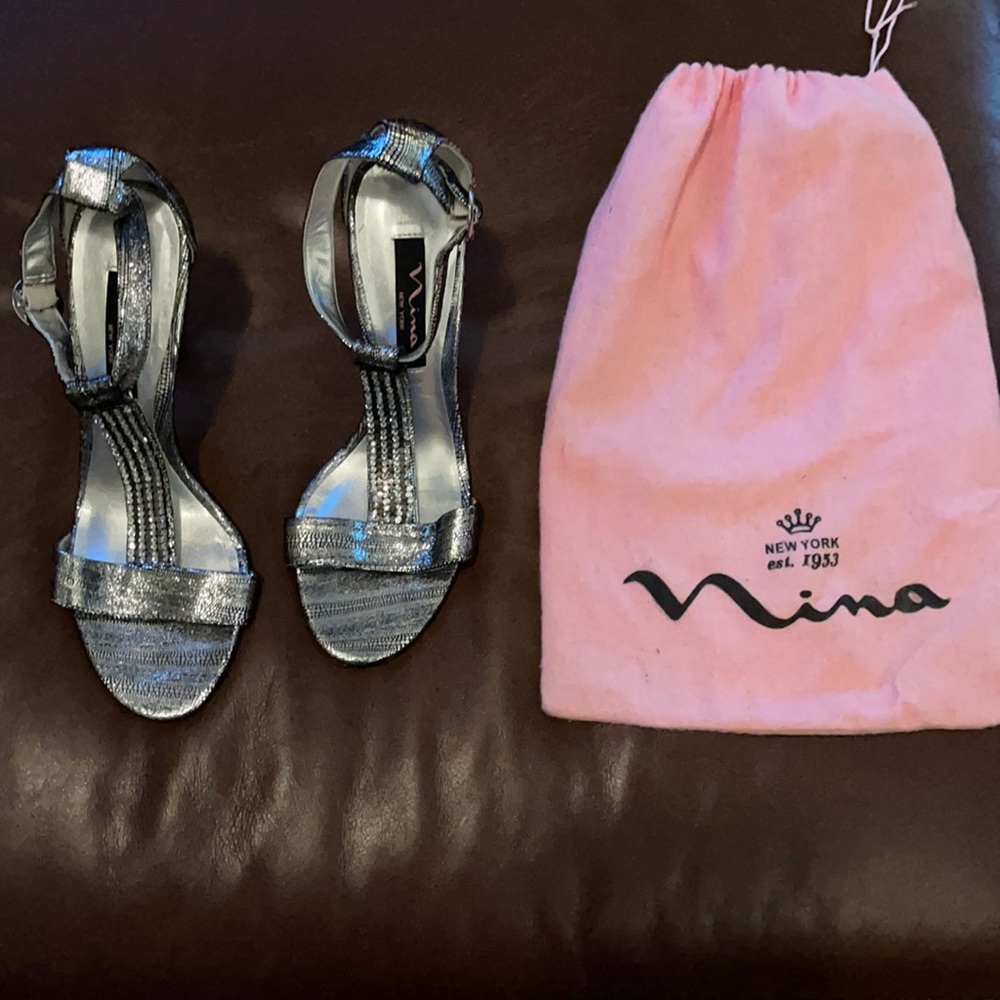 Silver heels with leather upper. Wore once
